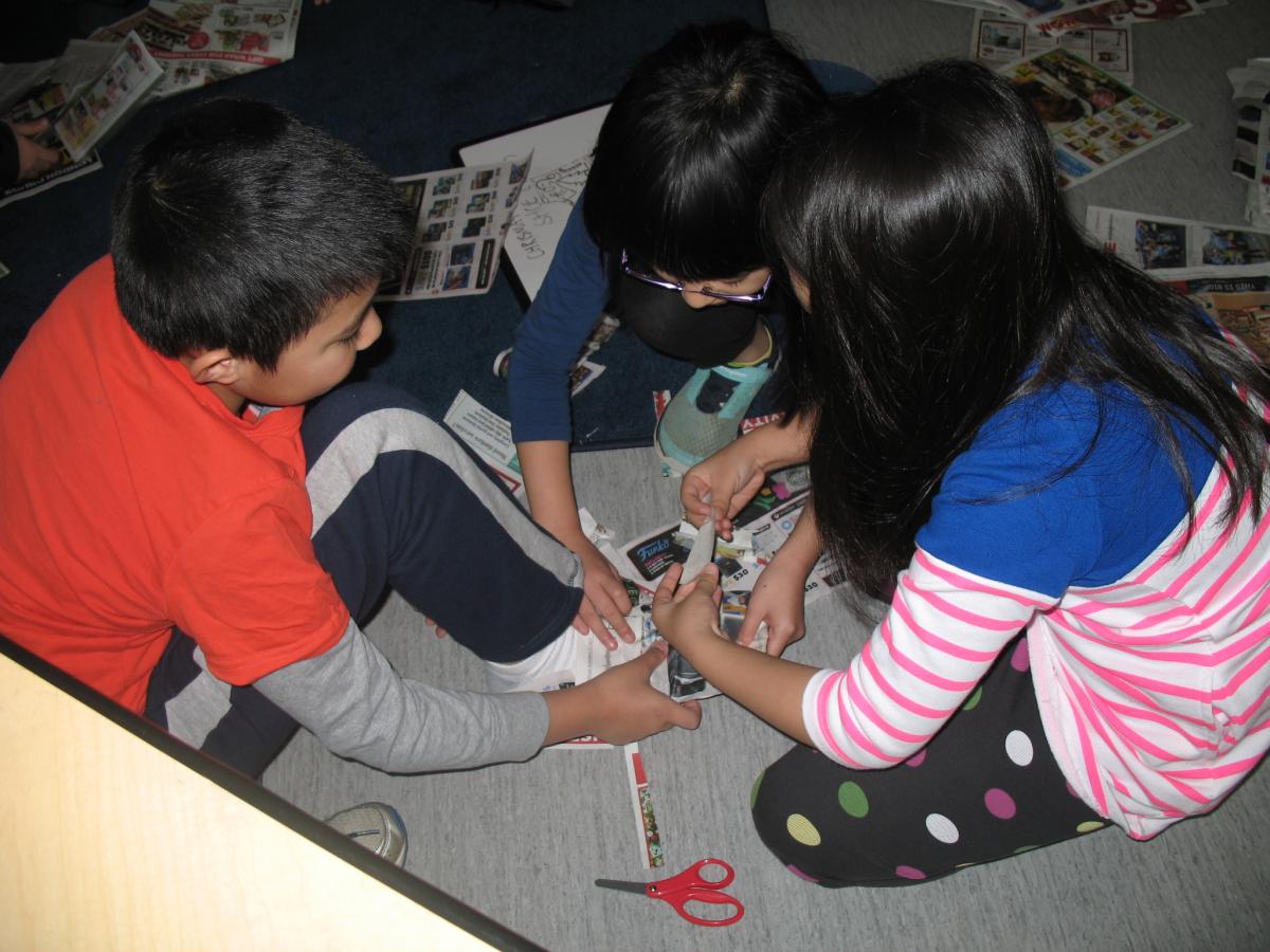 Working collaboratively to make a newspaper shoe